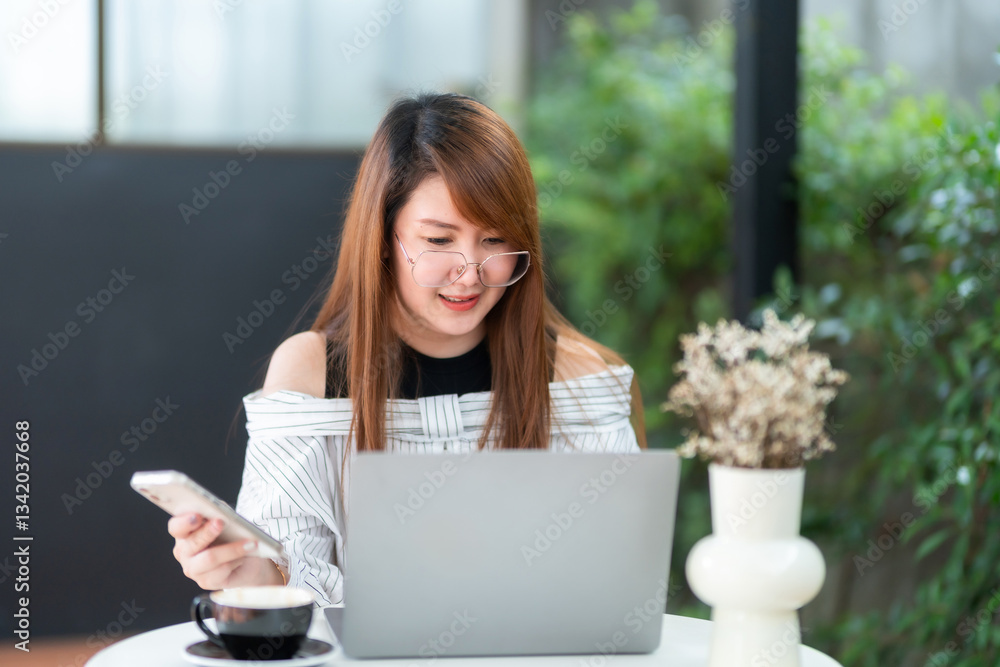 asian freelance people business female read writing message on smartphone using casual working with laptop computer for browsing internet, chatting and blogging and smartphone,notebook in coffee shop.