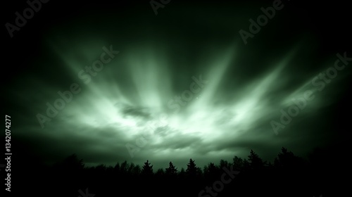 Dramatic green sky with illuminated clouds over the trees