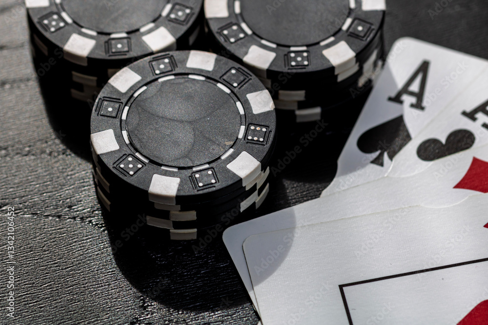 Naklejka premium Casino chips and cards on the table. Gambling concept