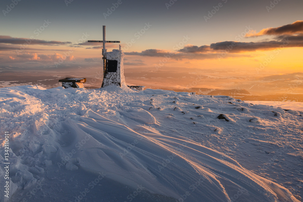 Babia Góra at sunset, covered in winter snow. A stunning mountain landscape in Babia Góra National Park, Poland. Golden light contrasts with icy peaks, creating a breathtaking view for nature and trav