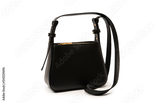 Black small leather cross body bag isolated on a white background.