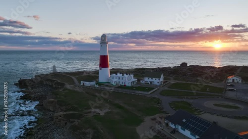 Sunset over Portland Bill Lighthouse from a drone, Portland Bill, Isle of Portland, Dorset, England