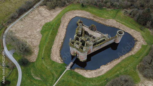 13 Century Caerlaverock Castle built with red sandstone and has a moat surrounded by earthwork ramparts. Near Dumfries, Scotland, UK