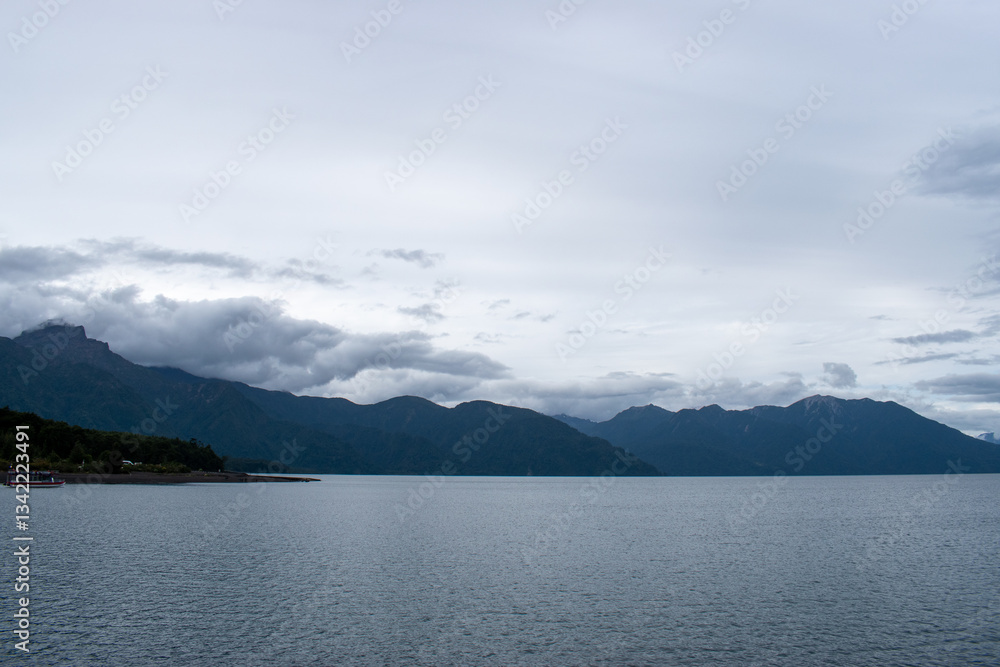 Scenic views of a lake surrounded by lush forests and rolling hills. Nature’s beauty unfolds with towering trees, serene waters, and distant mountains, creating a peaceful and pristine landscape Scenic views of a lake surrounded by lush forests and rolling hills. Nature’s beauty unfolds with towering trees, serene waters, and distant mountains, creating a peaceful and pristine landscape
