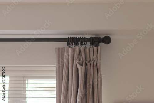 Wallpaper Mural The curtains hang on a black cornice in the bedroom and living room. This is a decoration of modern design. Torontodigital.ca