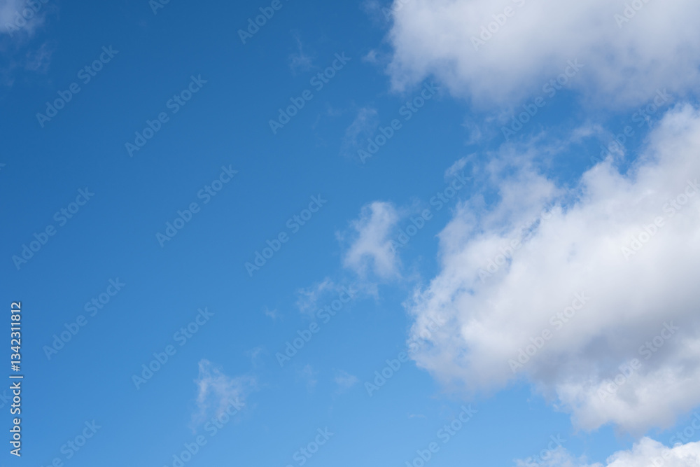 vast blue sky with fluffy white clouds scattered across, creating a serene and tranquil atmosphere, invoking a sense of calmness and freedom in the open expanse above, refreshing, gentle, sunny vast blue sky with fluffy white clouds scattered across, creating a serene and tranquil atmosphere, invoking a sense of calmness and freedom in the open expanse above, refreshing, gentle, sunny