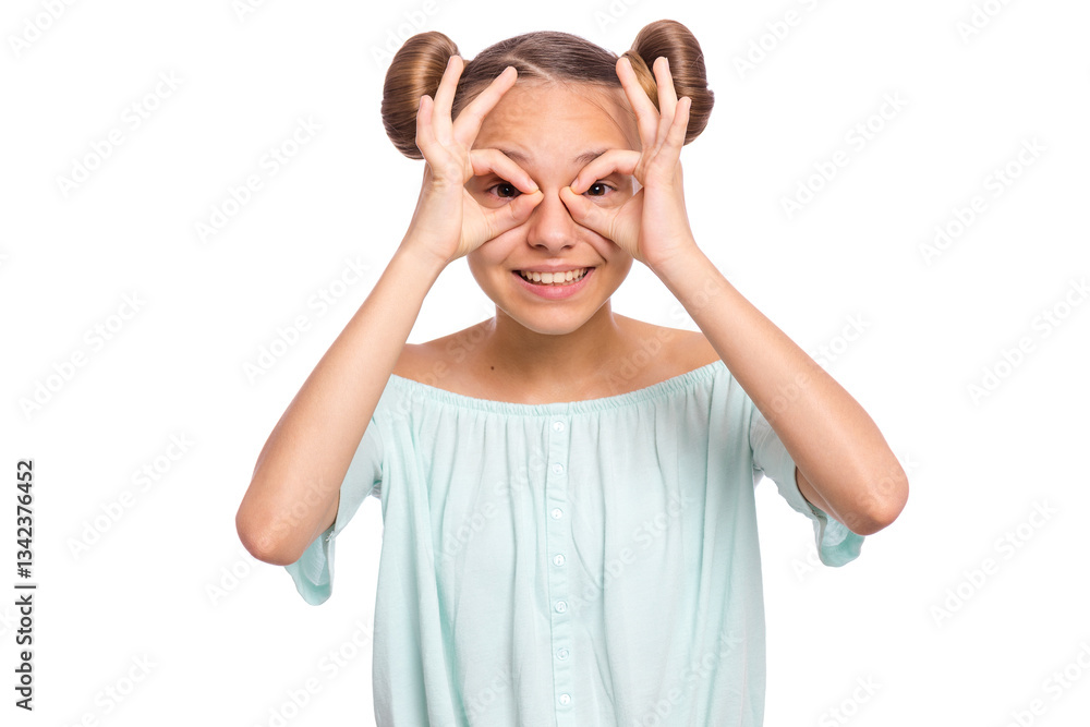 A young girl with playful hairstyle smiling and making a funny face with her hands. A young girl with playful hairstyle smiling and making a funny face with her hands.