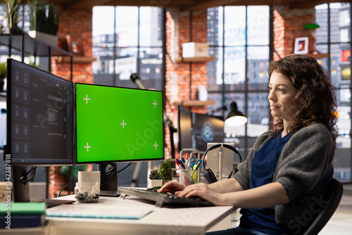 Obraz na płótnie Focused person interacting with a chatbot interface next to chroma key, AI system leverages machine learning and automation to generate helpful responses. Improve online data driven workflow. w salonie