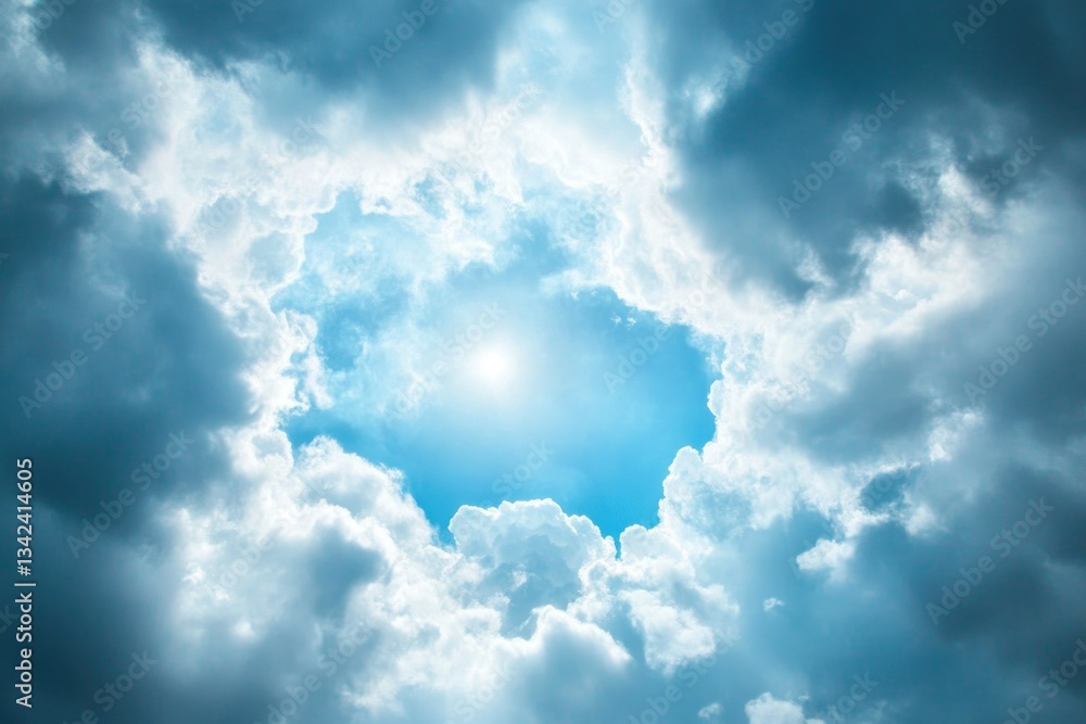 Fototapeta premium Cloudy sky with dark gray clouds and light blue in the center