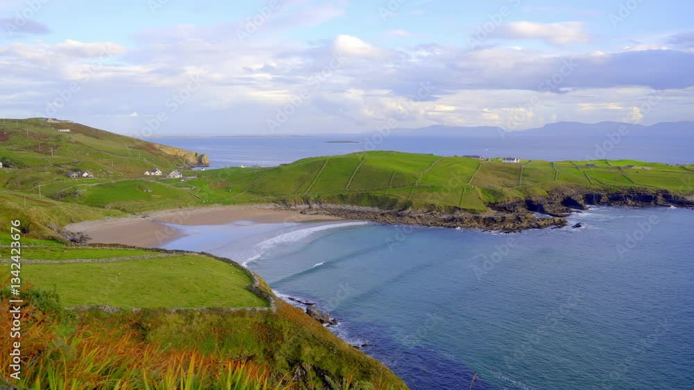 Muckross Head at the Irish west coast - A beautifully picturesque view of a serene bay that is surrounded by lush greenery and calm, tranquil waters Muckross Head at the Irish west coast - A beautifully picturesque view of a serene bay that is surrounded by lush greenery and calm, tranquil waters
