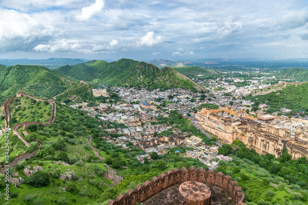 Fototapeta premium The view from Jaigarh Fort overlooks Amer Fort in Jaipur, the capital of Rajasthan, India, offering a stunning panorama of its historic architecture and surrounding landscapes.