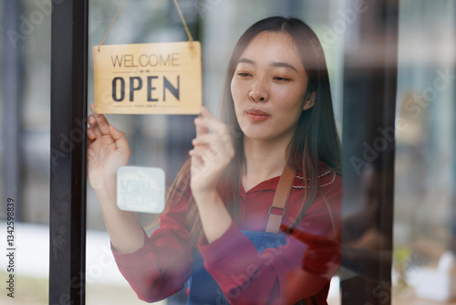Wallpaper Mural Startup successful small business owner sme beauty girl standing with a sign Opening a coffee shop restaurant. Portrait of asian tan woman barista cafe owner. SME entrepreneur seller business concept
 Torontodigital.ca