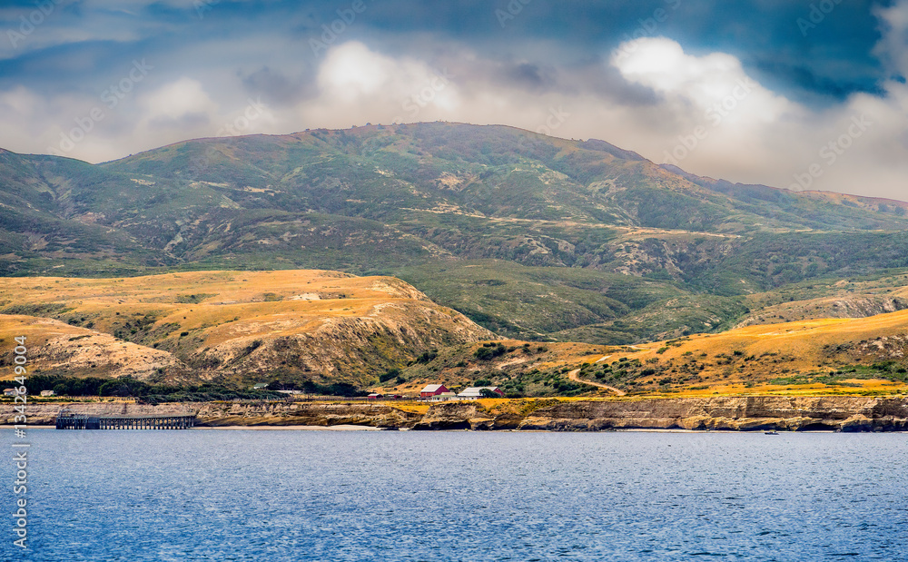 Striking dramatic skies hang over the coastal shores of the Channel Islands during a colorful Springtime day