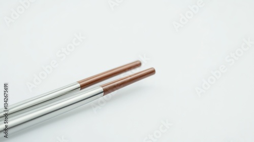 Wallpaper Mural Elegant Stainless Steel Chopsticks with Brown Tips for Asian Cuisine, Isolated on White Background Torontodigital.ca