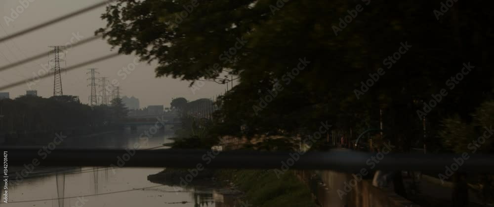 Water flowing in canal with bridge and cityscape background scene Water flowing in canal with bridge and cityscape background scene