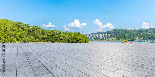Empty square floor and green forest with mountain nature landscape in summer