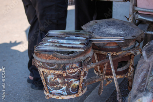 Grilled squid on a charcoal stove