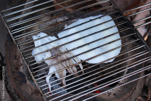 Grilled squid on a charcoal stove