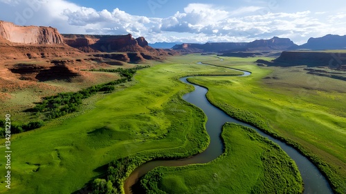 Winding River Flows Through Green Valley Landscape Surrounded by Mountains