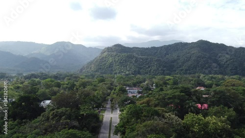 Scenic aerial view of mountains, highway, and lush landscape in Villavicencio, Colombia
