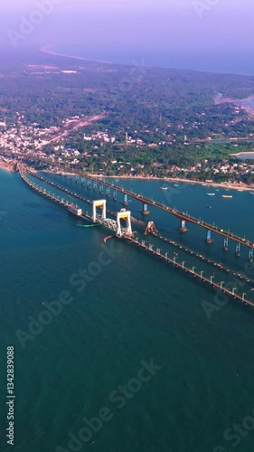 wide-angle drone view of pamban island village with boats and ocean
