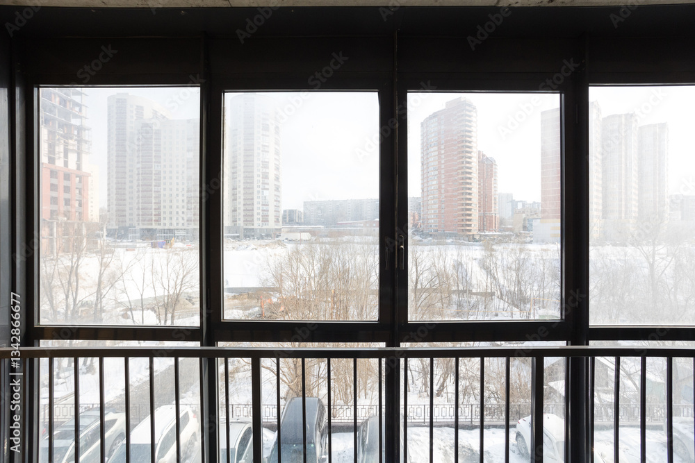 the balcony of an apartment on the upper floors of an apartment building the balcony of an apartment on the upper floors of an apartment building
