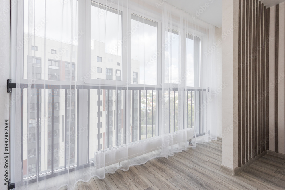 Fototapeta premium the balcony of an apartment on the upper floors of an apartment building