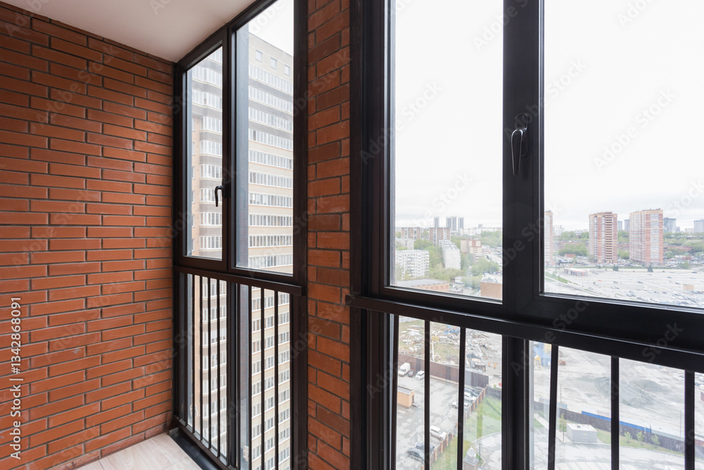 the balcony of an apartment on the upper floors of an apartment building the balcony of an apartment on the upper floors of an apartment building