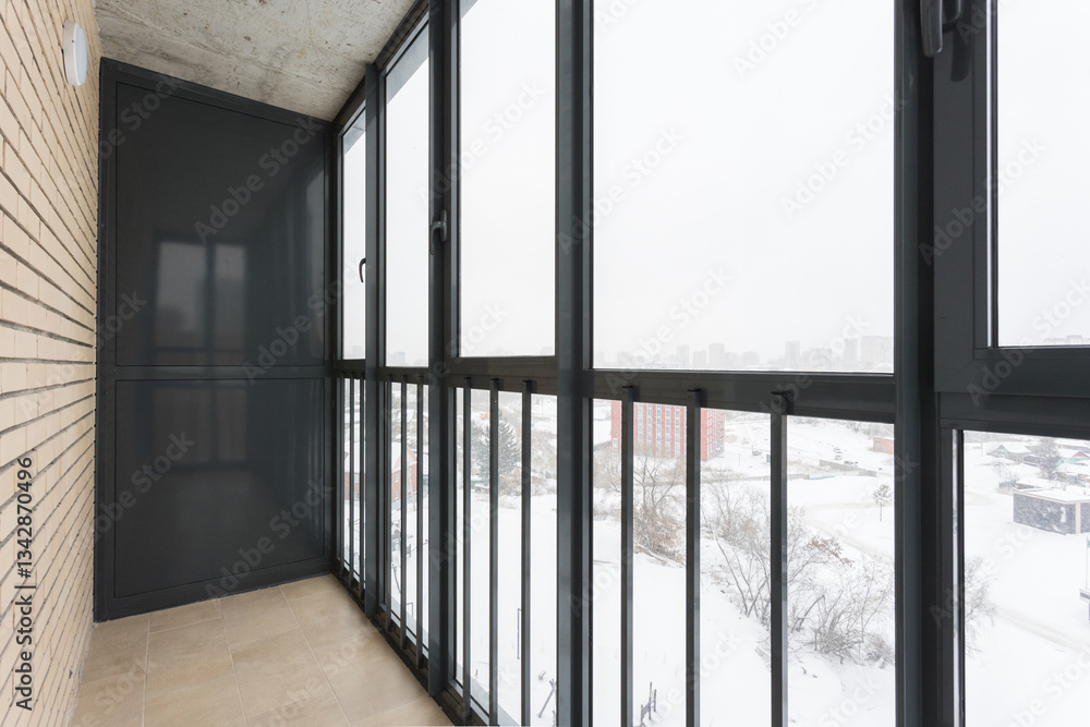 the balcony of an apartment on the upper floors of an apartment building the balcony of an apartment on the upper floors of an apartment building