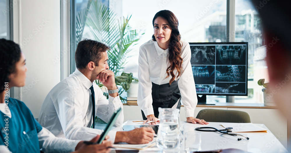 Fototapeta premium Woman, doctor or discussion with x ray on screen for meeting or planning surgery in boardroom. Female person, speaker or medical team with CT scan or display for health exam, diagnosis or results