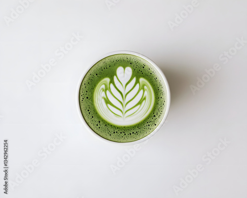 A calming matcha latte displaying intricate leaf art, evoking tranquility and mindfulness.