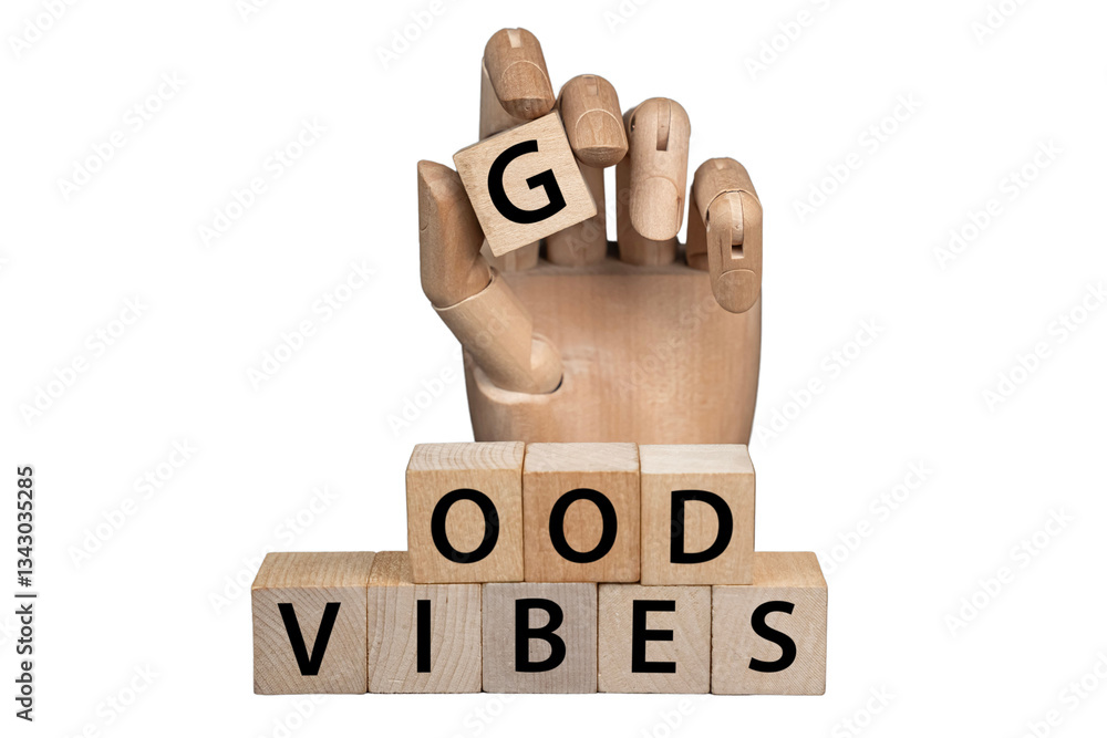 sztuczna ręka układająca z klocków napis: GOOD VIBES
