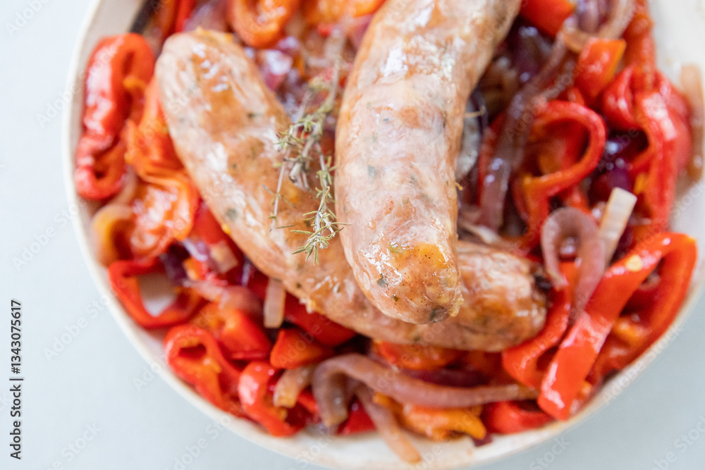 healthy sausages served with red onion and red bell pepper. a simple and flavorful dish perfect for an easy dinner healthy sausages served with red onion and red bell pepper. a simple and flavorful dish perfect for an easy dinner