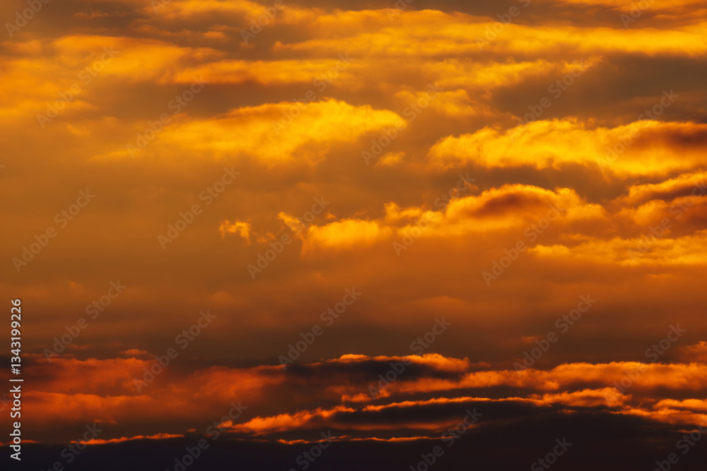 Fototapeta premium beautiful and dramatic sunset sky with bright yellow clouds as abstract background
