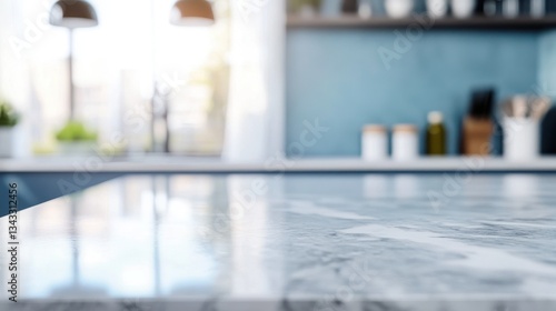 A smooth marble kitchen counter with a blurred background setting