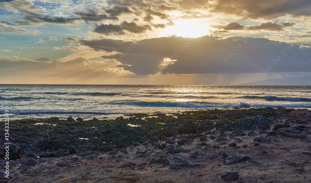 Sunset over rocky ocean shore Sunset over rocky ocean shore