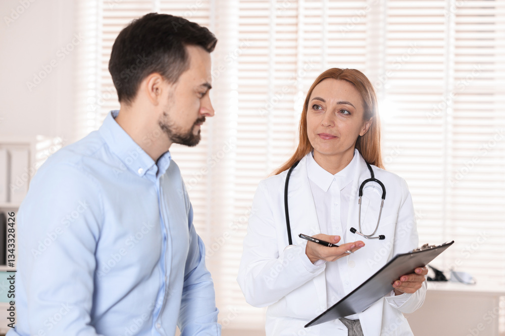Man having appointment with cardiologist in clinic Man having appointment with cardiologist in clinic