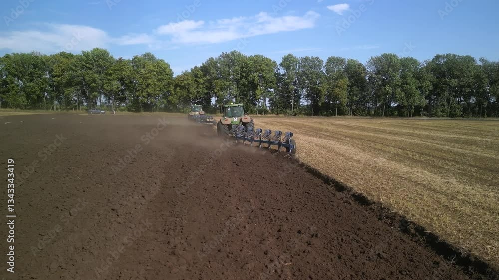Tractor Plowing the Fields with Plow Tractor Plowing the Fields with Plow