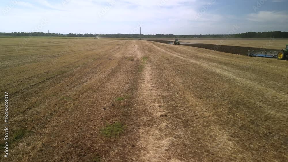 Tractor Plowing the Fields with Plow Tractor Plowing the Fields with Plow