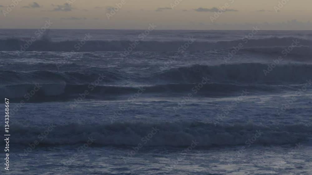 Ocean waves crashing against the coast after sunset in Caparica Ocean waves crashing against the coast after sunset in Caparica