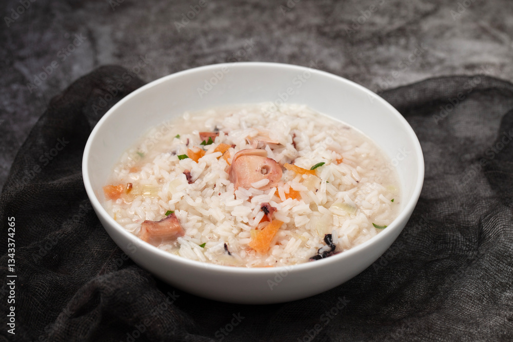 Boiled rice with octopus in white bowl Boiled rice with octopus in white bowl