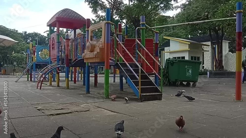 Wallpaper Mural children's playground with pigeons looking for food Torontodigital.ca