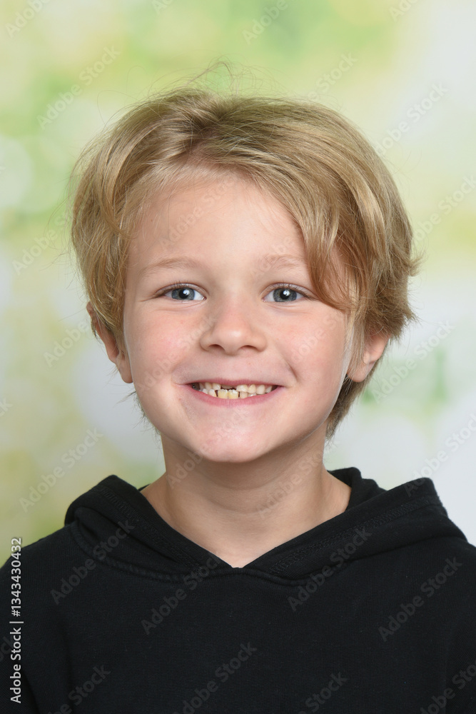 young blond child smiling from the front young blond child smiling from the front