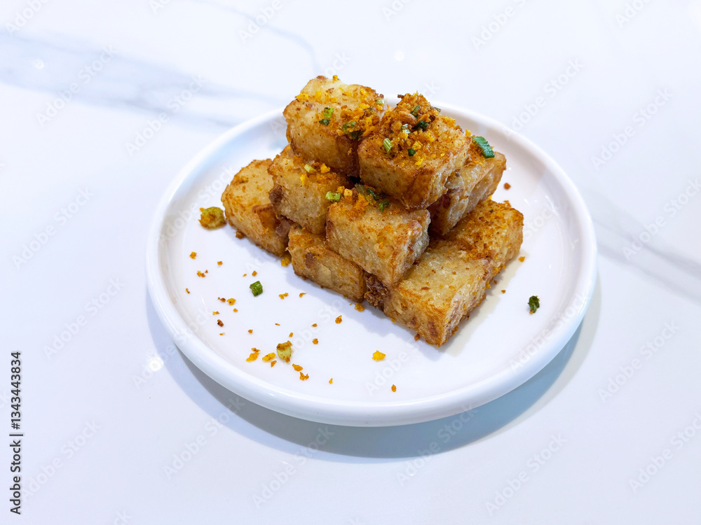 asian deep fried crispy vegetable carrot cake in square w garlic onion spices in plate on marble table chinese dim sum menu banquet restaurant vegan halal food