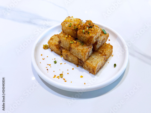 Obraz na płótnie asian deep fried crispy vegetable carrot cake in square w garlic onion spices in plate on marble table chinese dim sum menu banquet restaurant vegan halal food w salonie
