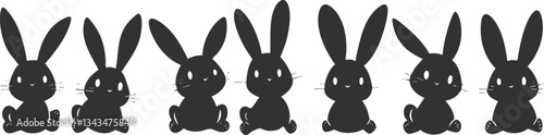 Silhouette of cute sitting bunnies in a row on white background