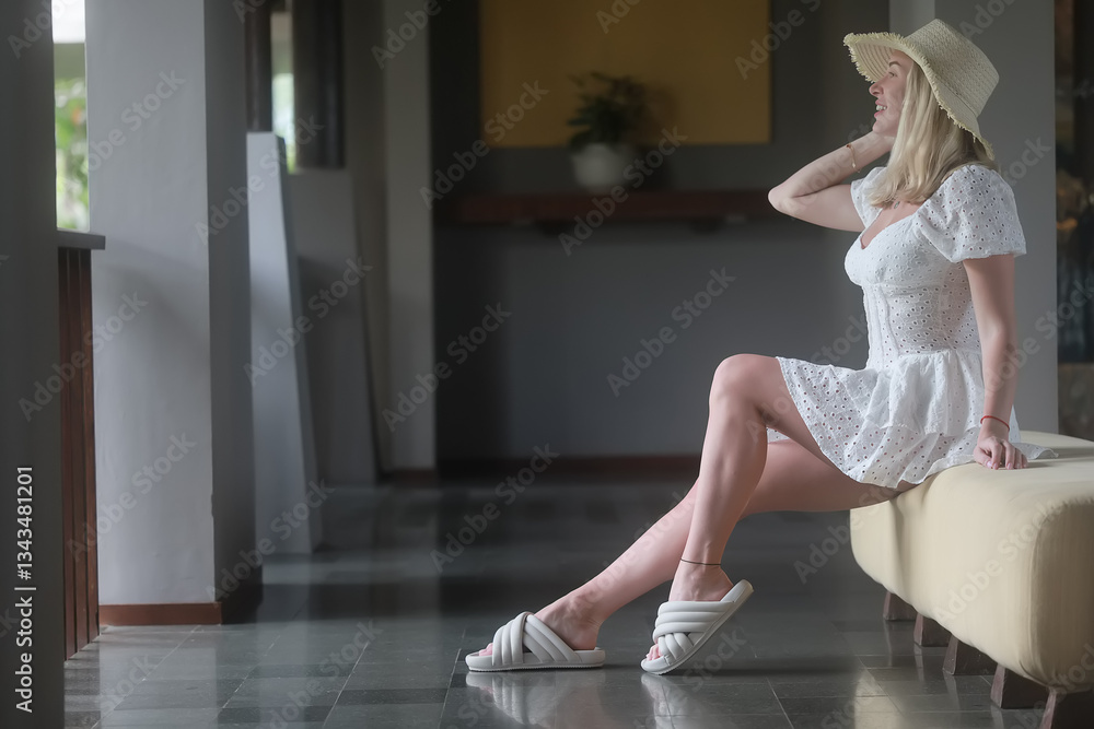 Fototapeta premium Young adult girl model posing fun in a hotel on summer vacation