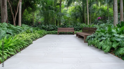 Obraz na płótnie Tranquil garden path with benches. Lush greenery surrounds a paved walkway w salonie
