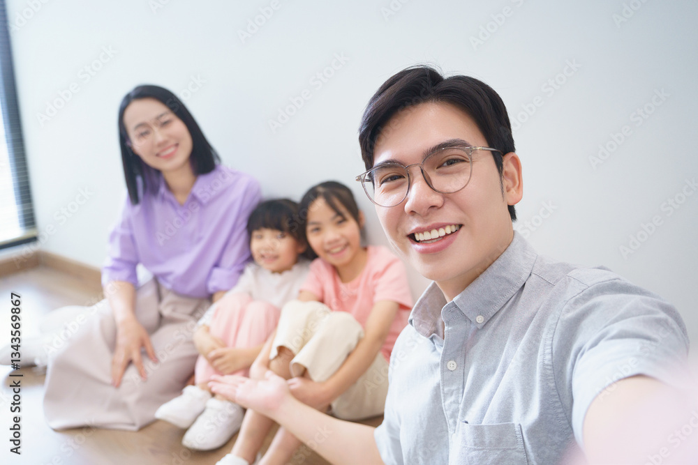 Family enjoying quality time together in a modern, cozy room during a sunny afternoon Family enjoying quality time together in a modern, cozy room during a sunny afternoon