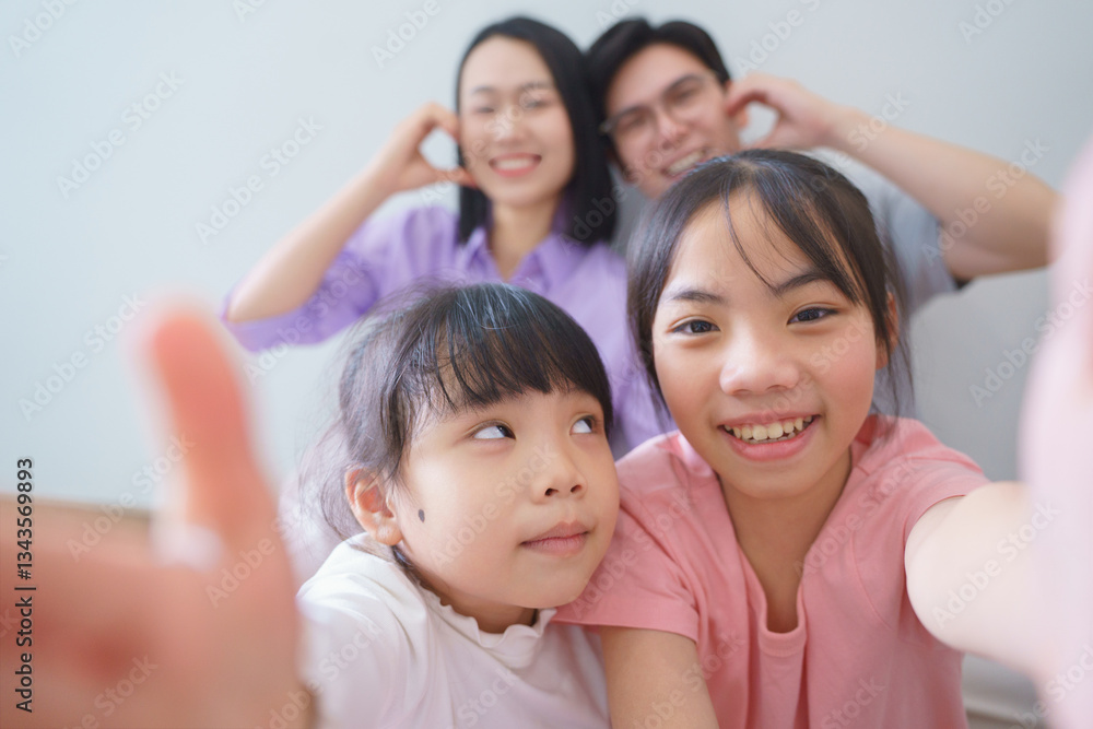 Families enjoying joyful moments together indoors with playful expressions captured in a warm and loving atmosphere Families enjoying joyful moments together indoors with playful expressions captured in a warm and loving atmosphere